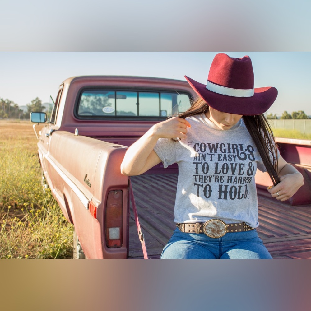 “Cowgirls ain’t easy to love & they’re harder to hold” gray tee